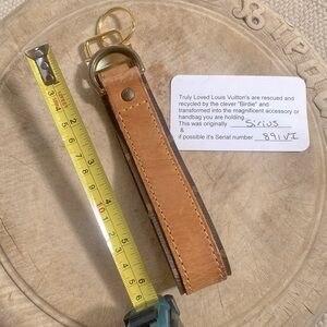 COPY - COPY - Recycled keychain made from an authentic strap of a LOUIS Vuitton…